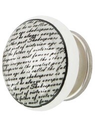 White Porcelain Vintage Text Cabinet Knob with Brass Base in Polished Nickel.
